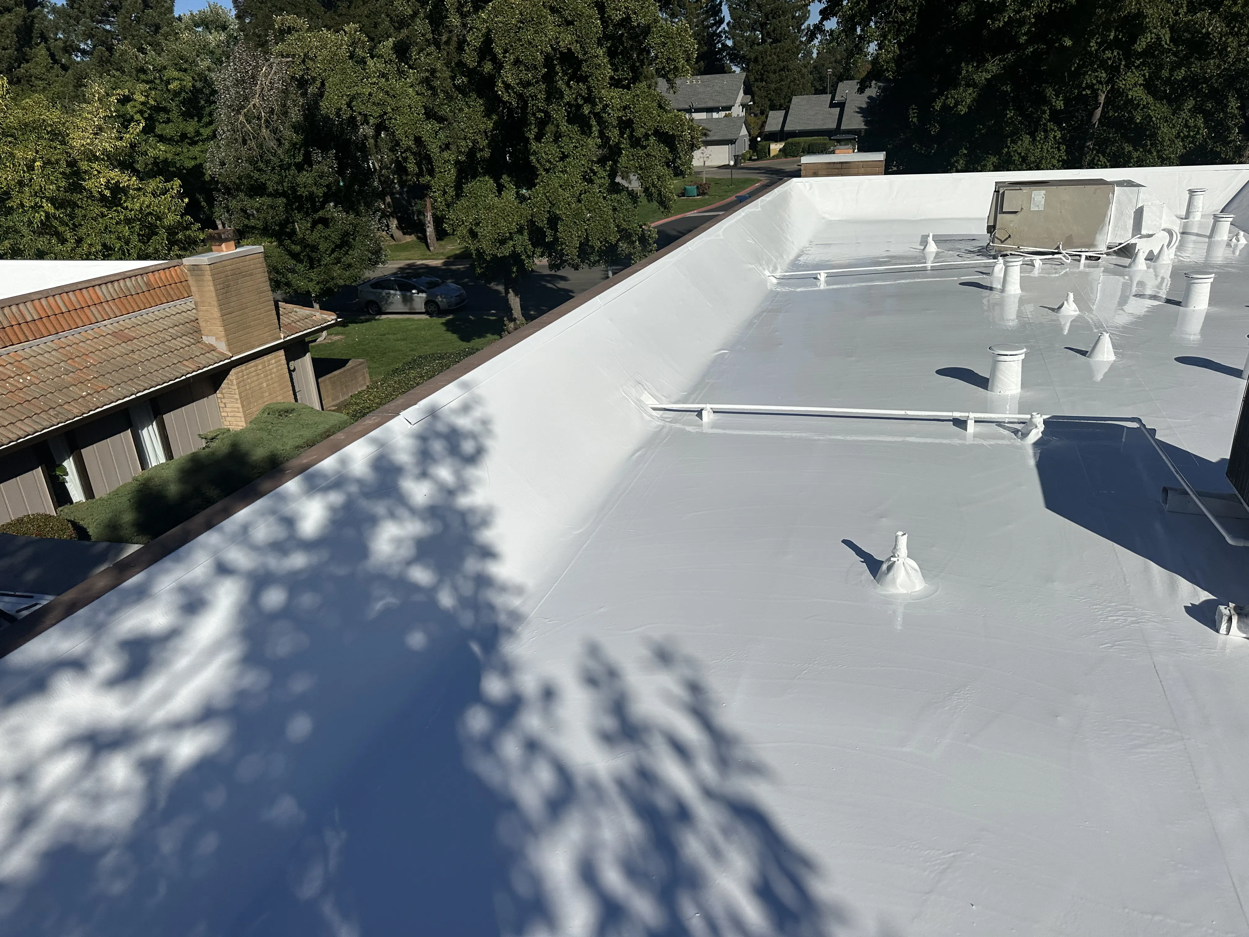 Pressler Home Performance roofing project: Cool Roof Coating Installation on Flat Roof in Roseville, CA